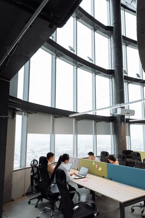 Colleagues working together in an open-plan office